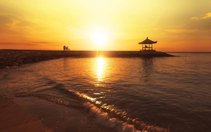 a sunset over a body of water