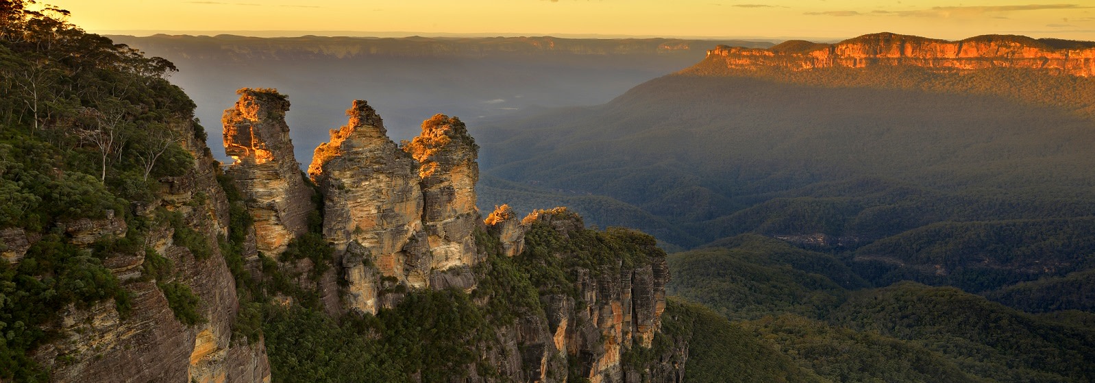 Enchanting Travels Australia ToursSunrise in Blue Mountains. View on Three Sisters Rock Formation Australia Vacation - The Grampians