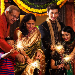 Enchanting Travels India Tours Indian Family celebrating Diwali festival with fire crackers