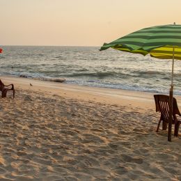 Enchanting Travels India ToursChairs and umbrella at Marari Beach, Kerala. It is one of the most popular beaches in Kerala