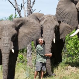 Enchanting Travels-Botswana Tours-Okavango Delta-Sanctuary Stanley's Camp-Doug hugging Tembi Marula and Jabu low
