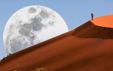 Dune walking in the Namib Desert at Sossusvlei in Namibia