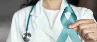 A person in a white lab coat and stethoscope holds a teal ribbon, representing ovarian cancer awareness. The focus is on the ribbon held in their hand.