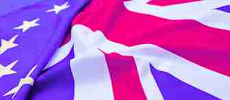 A close-up of the American and UK flags arranged side by side, creating a waving pattern. The stars from the American flag and the red, white, and blue design of the UK flag are prominently visible and blend together in the center.