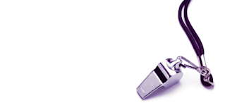 A shiny silver whistle attached to a black lanyard is positioned on a white background, with the lanyard coiled in loops next to the whistle.