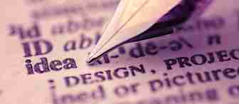 A close-up image of a fountain pen tip pointing at the word "idea" in a dictionary. The surrounding text is slightly blurred, emphasizing the word "idea". The scene is bathed in a subtle, warm, purple hue.