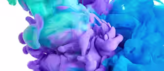 A vibrant swirl of purple, turquoise, teal, and blue ink disperses in clear water against a white background, creating an abstract and vivid display of color blending and fluid motion.