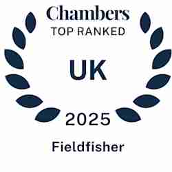 Laurel wreath design with text: "Chambers Top Ranked UK 2025 Fieldfisher.