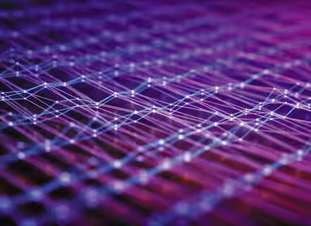 A close-up image depicting an abstract, interconnected network of glowing lines and nodes against a gradient background of purple, pink, and blue hues. The lines form a complex web, creating a futuristic and digital aesthetic.