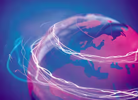 A semi-transparent globe on a blue background with highlighted continents and swirling, glowing lines encircling it, signifying global connectivity and communication. The image emphasizes technological interconnections across the world.