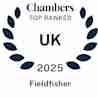 Laurel wreath design with text: "Chambers Top Ranked UK 2025 Fieldfisher.