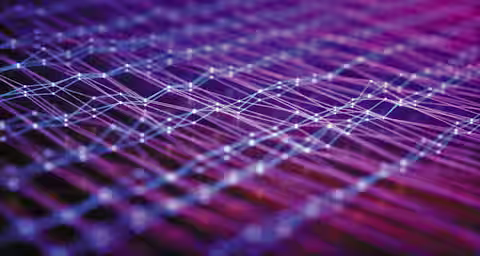 A close-up image depicting an abstract, interconnected network of glowing lines and nodes against a gradient background of purple, pink, and blue hues. The lines form a complex web, creating a futuristic and digital aesthetic.