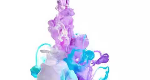 A vibrant swirl of purple, turquoise, teal, and blue ink disperses in clear water against a white background, creating an abstract and vivid display of color blending and fluid motion.