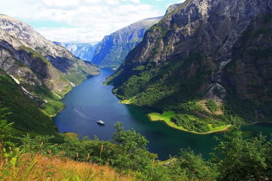 Fjord1 ferry navigating across Norwegian fjords during spring