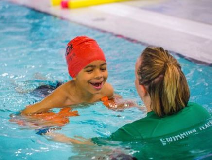 child learning to swim