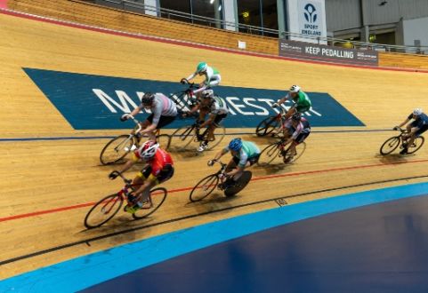 Cyclists in a velodrome