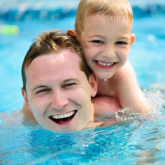 A father and son enjoying spending time together in the pool at Hatfield Swim Centre