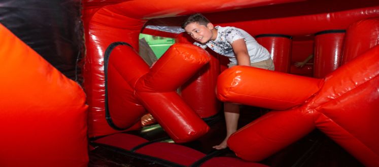 Junior enjoying an inflatable fun session.