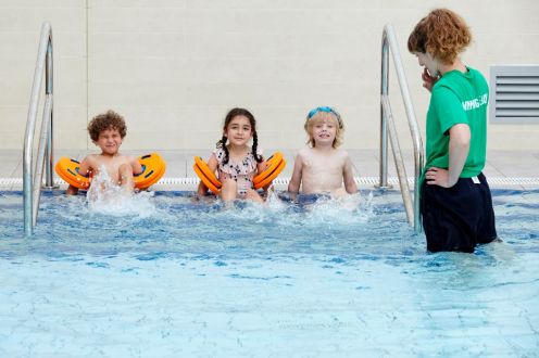 Children Splashing feet in the water 