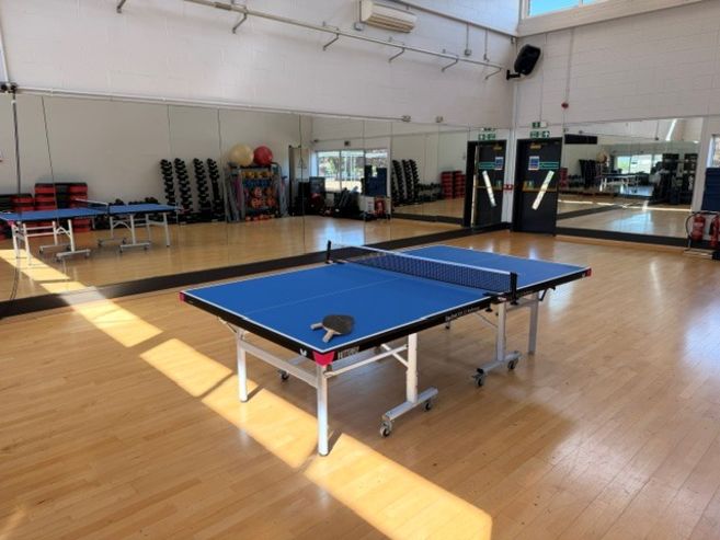 Studio space with table tennis set up for play