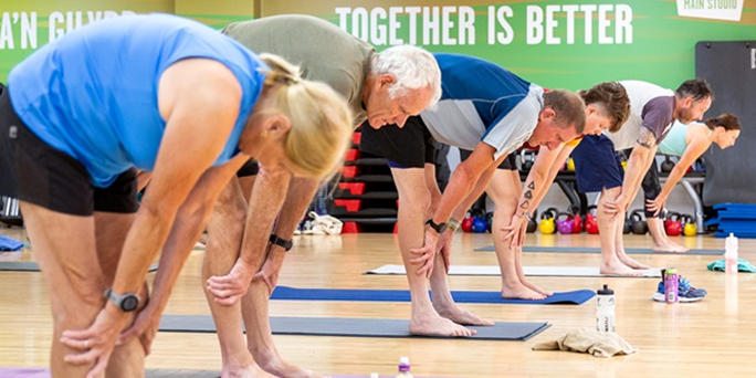 A group of older people in a Pilates class A group of older people in a Pilates class
