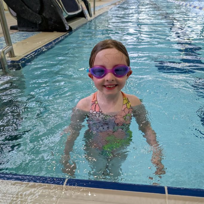 Girl in water wearing goggles