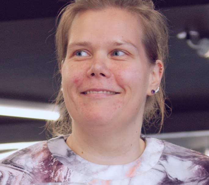 A lady smiling in the gym