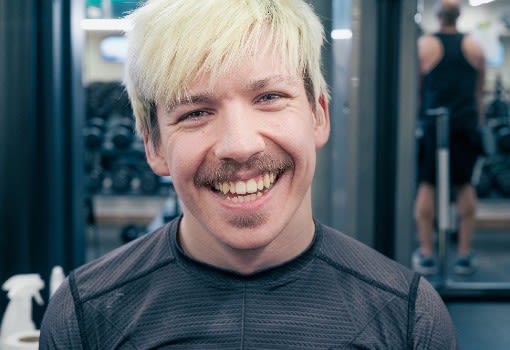 Better member smiling in the gym 