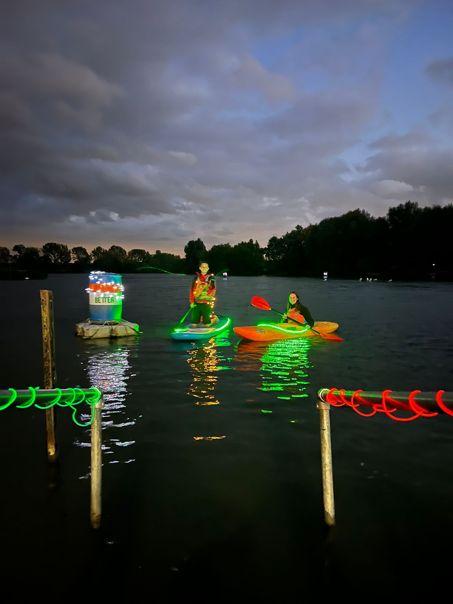 Moonlight paddle SUP & Kayak lit up in colours on lake