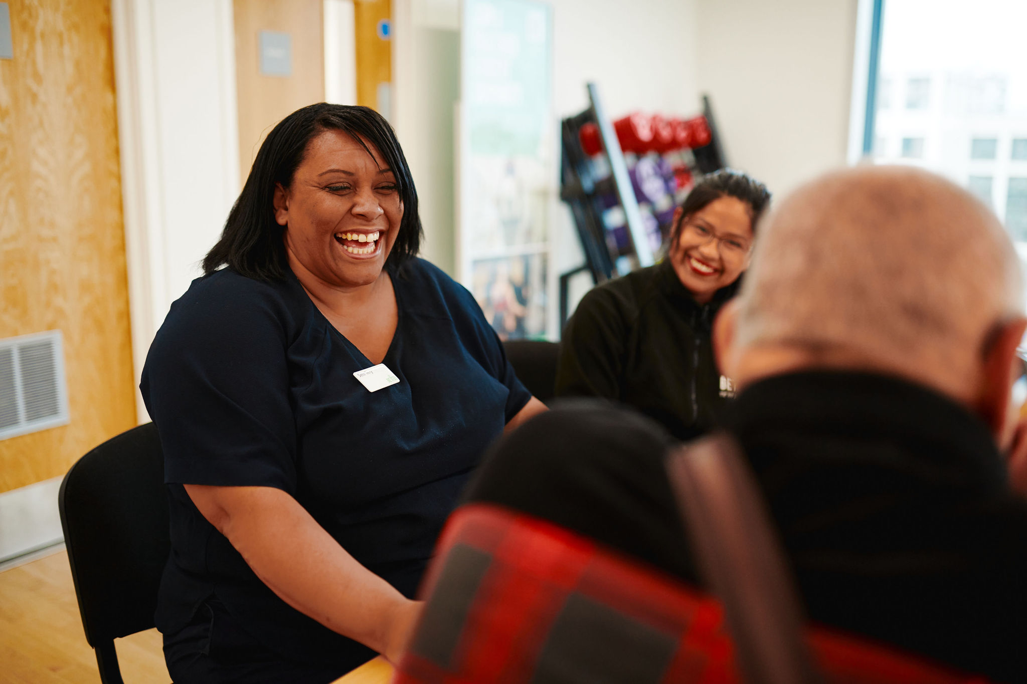 A woman in a room smiling A woman in a room smiling