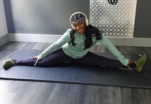 Trisha stretching at the gym