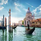 A Gondola Rowing on the Grand Canal in Venice 