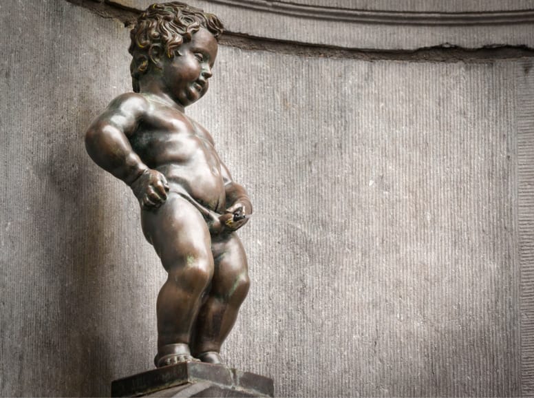 The Manneken Pis Statue in Brussels Urinating into a Fountain