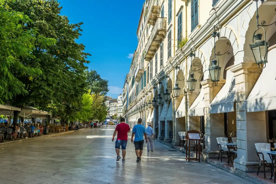 people walking along arcade