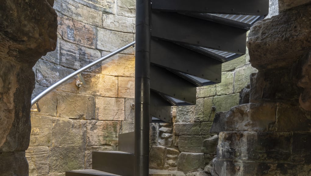 Interior view of a spiral staircase at Clifford's Tower