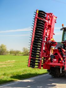 Kverneland F35 compact travelling on road with tractor