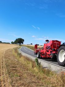 Kverneland U-drill, transported on road by tractor