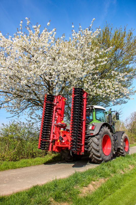 Kverneland F35 compact travelling on road with tractor