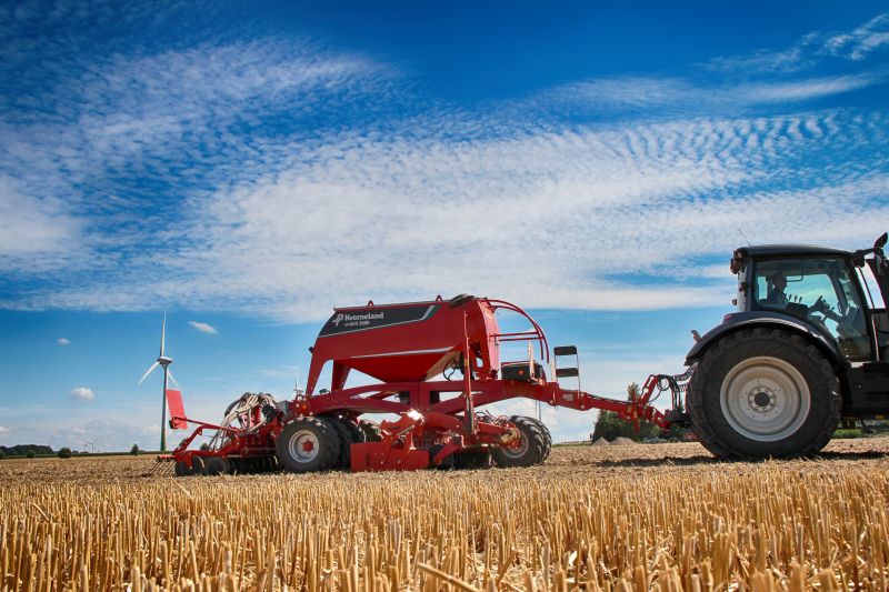 Kverneland U-drill, transported on road by tractor