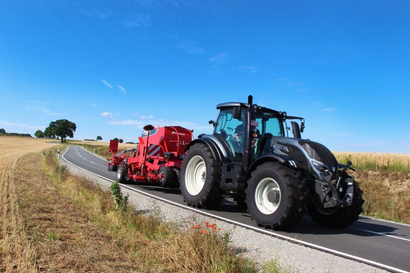 Kverneland U-drill, transported on road by tractor