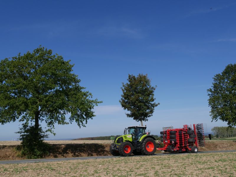 Kverneland U-drill, transported on road by tractor