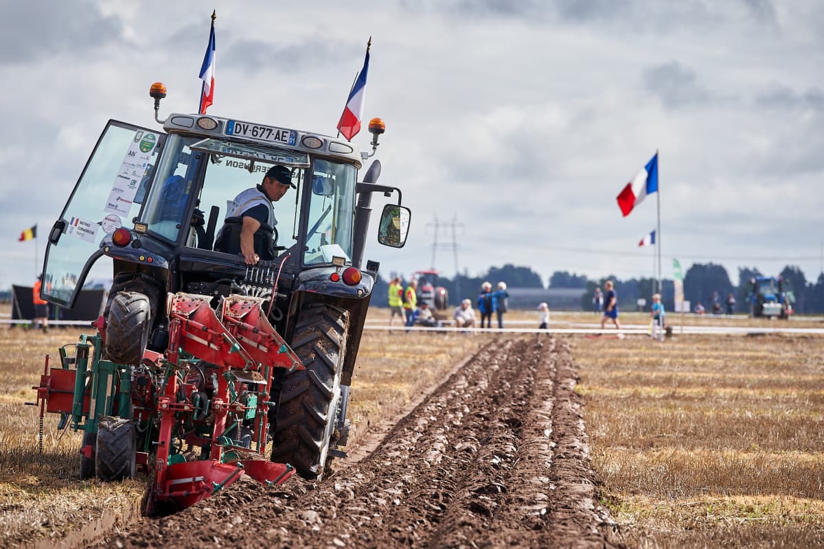 Man ploughing under The World Ploughing Contest 2024