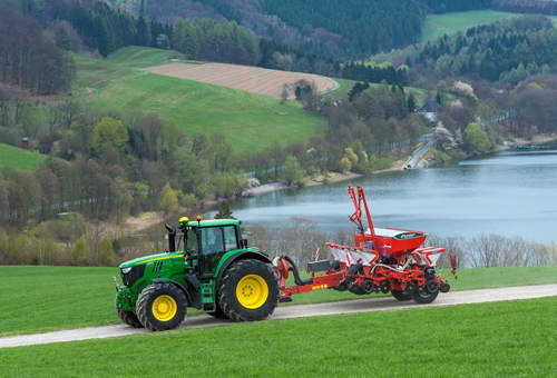 Pneumatic precision drills - Kverneland optima TFprofi transported efficiently on road by tractor folded for safe travell
