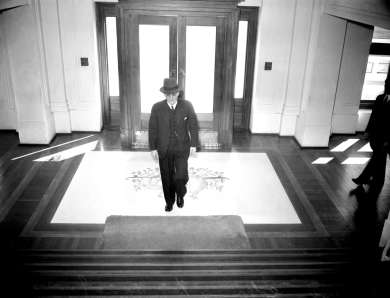 Prime Minister John Curtin enters Parliament House, Canberra on 3 July 1942, ahead of a press conference