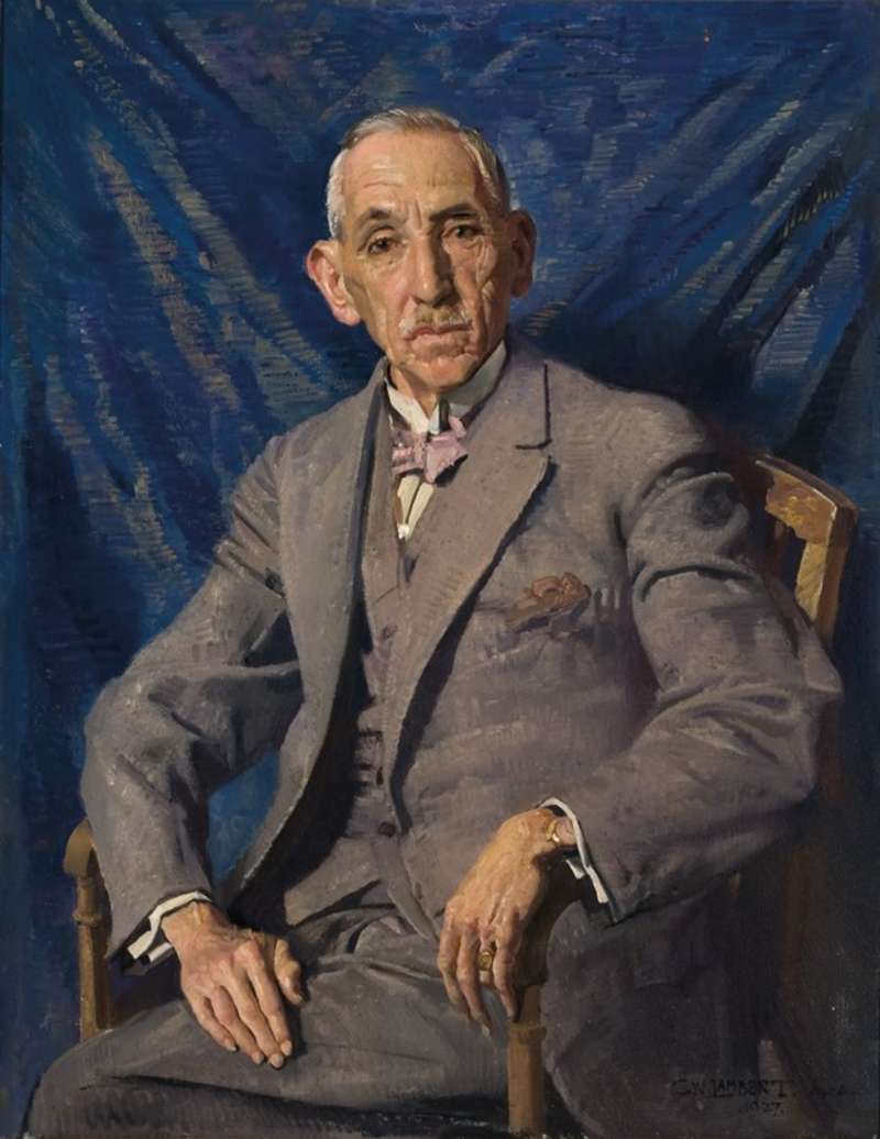 A painting of Prime Minister Billy Hughes. Billy wears a grey suit, a lavender bow tie, and sits cross-legged against a blue background.