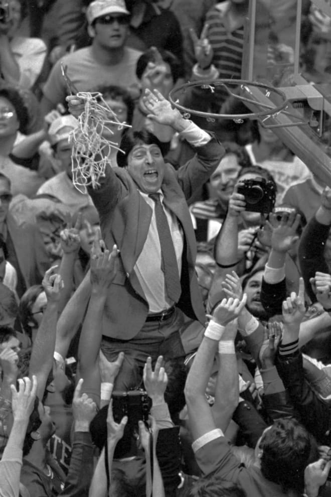 NC State Wolfpack basketball head coach Jim Valvano cuts down the nets.