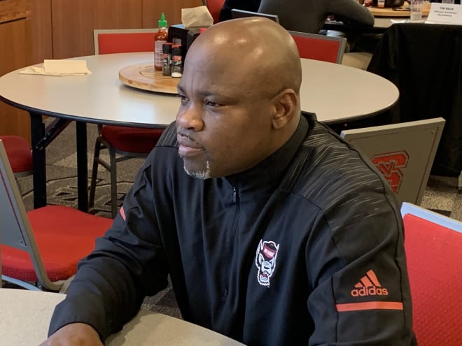 NC State Wolfpack football cornerbacks coach Brian Mitchell talks to the media.