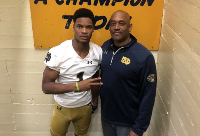 Notre Dame freshman Jordan Johnson with Notre Dame wide receivers coach Del Alexander.