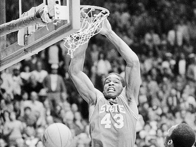 NC State Wolfpack basketball forward Lorenzo Charles dunks it.