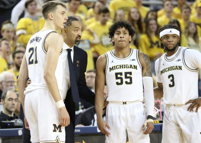 From left: Michigan Wolverines basketball's Franz Wagner, Juwan Howard, Eli Brooks and Zavier Simpson